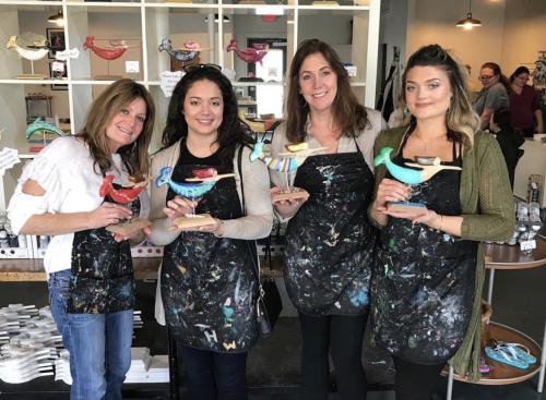 Four Women Holding Their Art Souvenirs At Mermaid Factory In Virginia Beach