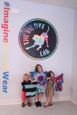 Getting their pictures at The Tie Dye Lab's social media wall