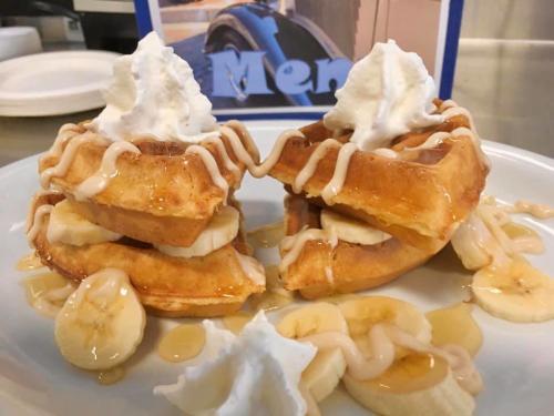 Plated banana waffles with whipped cream at 416 Diner in Dayton, OH