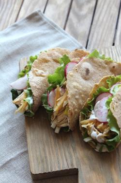 Delicious tacos served with sour cream and guacamole