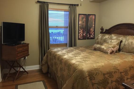 Guest king size bedroom with historic Grand Lagoon view