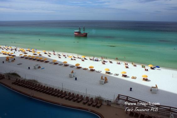 View from our 802 sq ft wrap around balcony of pool and beach as the pirate ship sails by