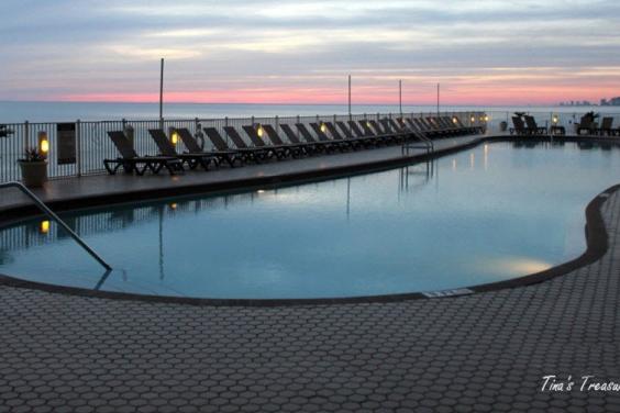 Beach Front 120 ft long heated pool at sunset
