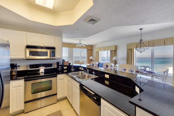 Granite, chrome appliances and fully stocked kitchen