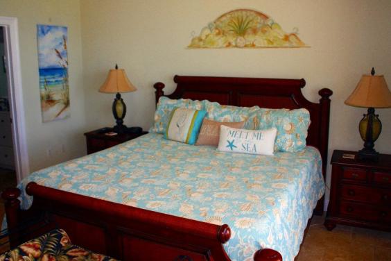Master bedroom suite with HD Flat screen TV, DVD player and balcony access