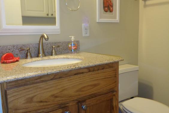 Upgraded bath with granite counter, oak vanitiy