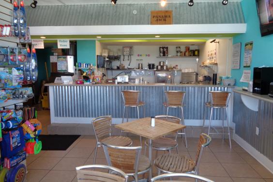 Liza's Kitchen is now poolside with sandwiches, tropical drinks, beach items