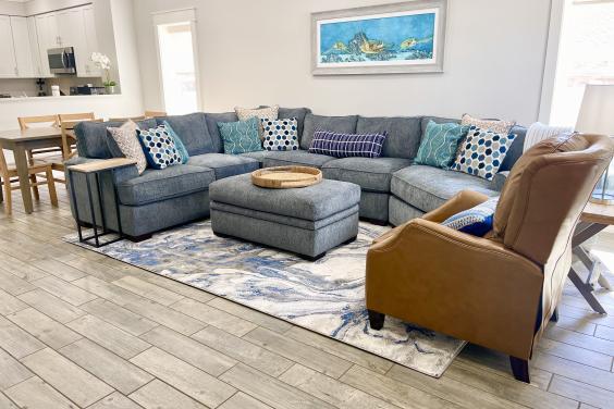 Living room featuring a large sectional and recliner