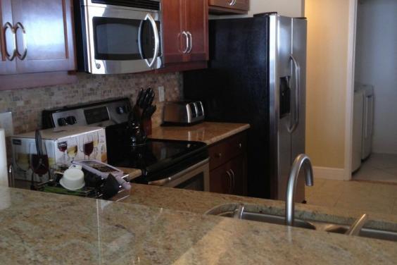 Kitchen with granite countertops and stainless appliances