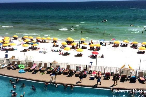 View from our 802 sq ft wrap around balcony of pool and beach