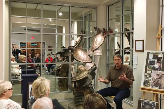 Artist Paul Saviskas explaining his creative process to members of the Center for the Arts