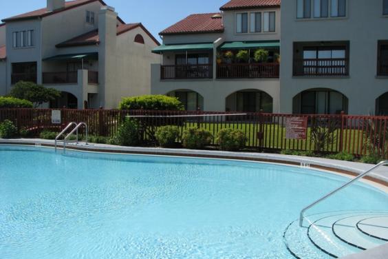 Grand Lagoon Condo with boat dock. Walk to beach.