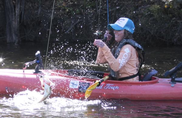 A woman catching a fish