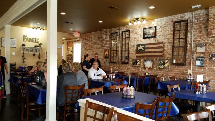 Holy Smoke Hog Roast Company is cozy and decorated in an Americana style.