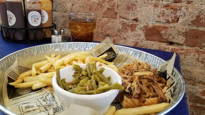 Pulled pork dinner with fries and green beans at Holy Smoke Hog Roast Company in Martinsville.