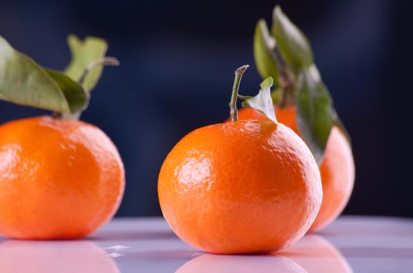 Use citrus - like satsumas - for a festive centerpiece.