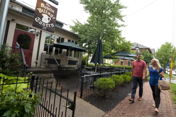 Couple walking to the Dublin Village Tavern Patio