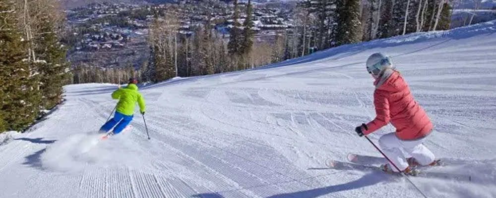 Spring Skiers going down the mountain in Park City