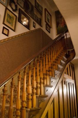 The original 1865 staircase still carries guests to the upper floors of the Twin Turrets Inn