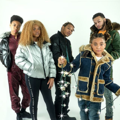 Five people wearing wintertime outerwear