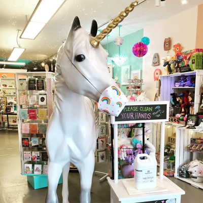 Unicorn Feed and Supply mascot wearing a mask