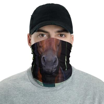 Man in black hat models a gaiter printed with the snout of a brown horse