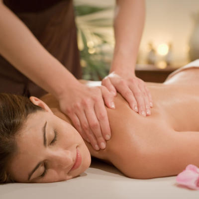 Woman getting a massage at the Woodhouse Day Spa