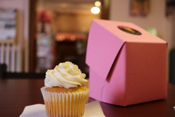 Vanilla cupcake and pink box from Our Cupcakery