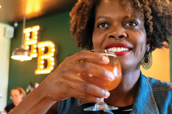 Girl with drink at Hunter's Brewing