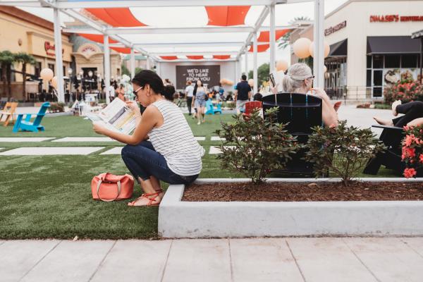 Woman sitting in the Lawn.