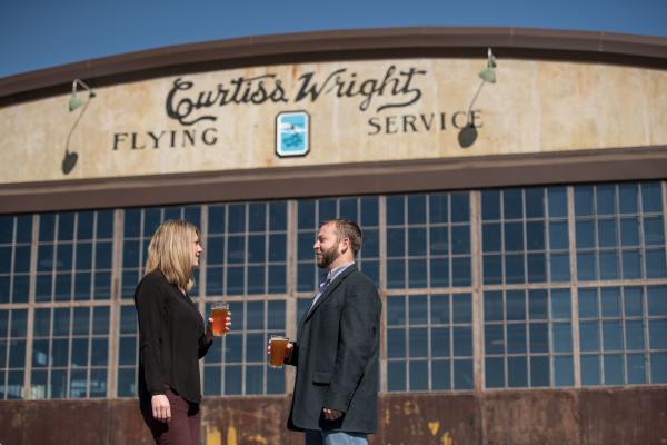 Couple at Hunter Gatherer Brewery at Curtiss-Wright Hangar
