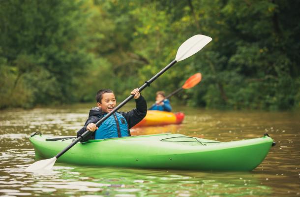 Boys paddling big creek