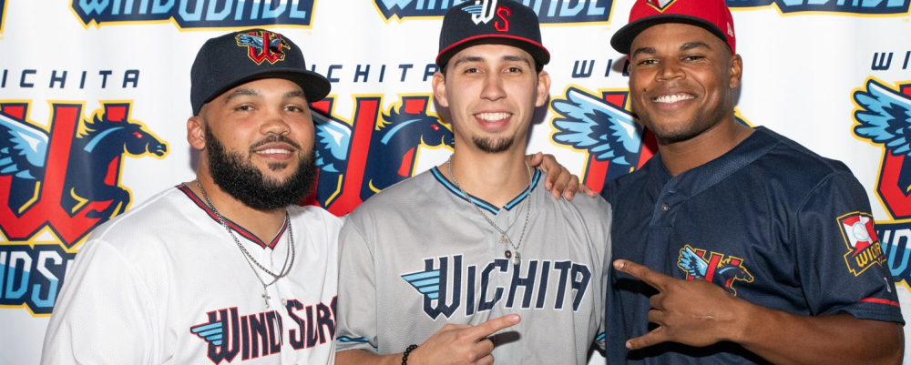 Three players for the new Wichita Wind Surge baseball team pose for the camera in uniform