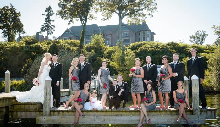 Photo of a wedding party outside on a dock at Belhurst Castle Photo of a wedding party outside on a dock at Belhurst Castle