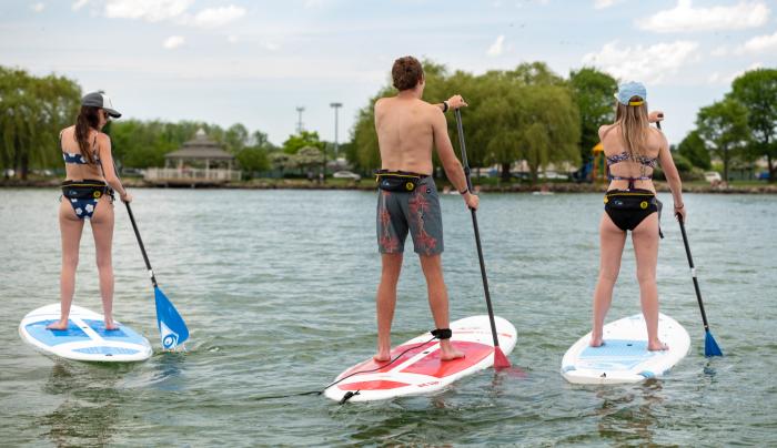 People stand up paddleboarding People stand up paddleboarding