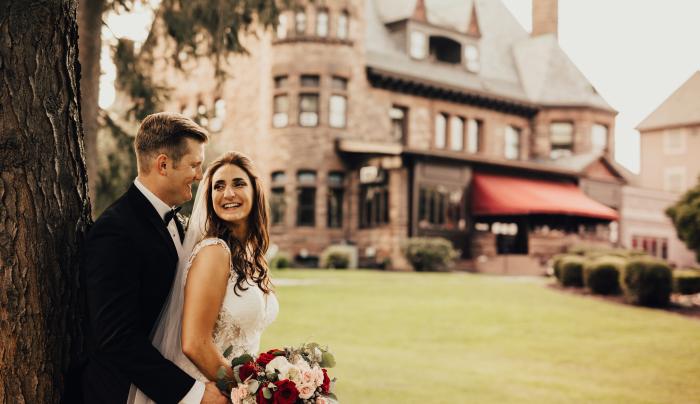 Photo of Bride and Groom by a tree at Belhurst Casle Photo of Bride and Groom by a tree at Belhurst Casle