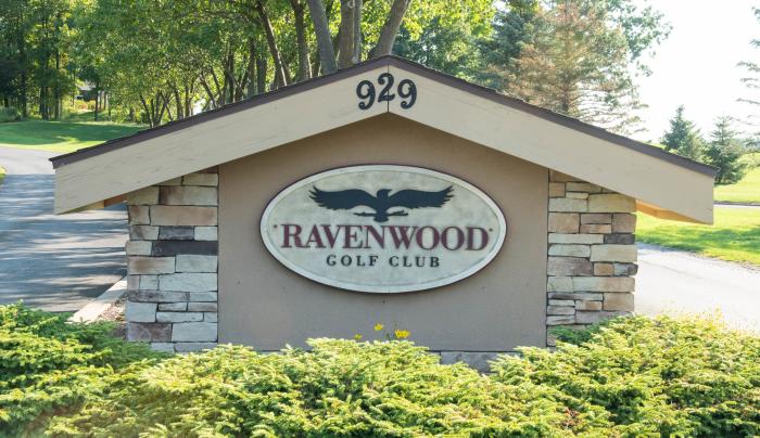 Exterior sign of Ravenwood Golf Course on a sunny day Exterior sign of Ravenwood Golf Course on a sunny day