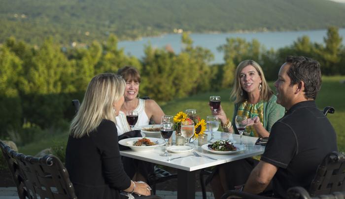 Guests Dining on Outdoor Patio at Bristol Harbour Guests Dining on Outdoor Patio at Bristol Harbour