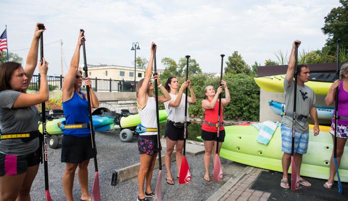 Customers practice for some stand up paddle boarding on Canandaigua Lake Customers practice for some stand up paddle boarding on Canandaigua Lake