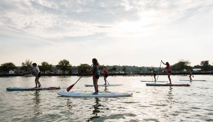 Customers participate in stand up Paddle boarding on Canandaigua Lake Customers participate in stand up Paddle boarding on Canandaigua Lake