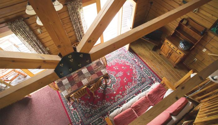 Photo from the loft looking down to the living room in the Hemlock cottage Photo from the loft looking down to the living room in the Hemlock cottage