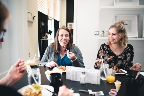 Friends sitting at a table enjoying their meal