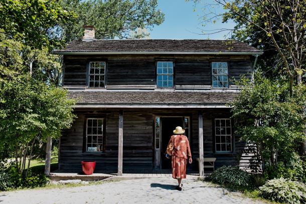 woman walking into uncle toms cabin