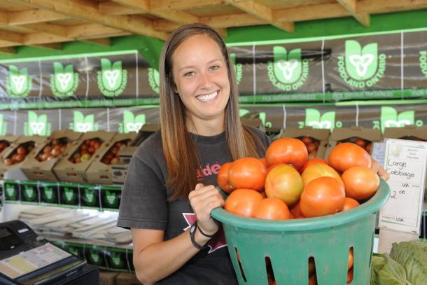 woman holding tomatoes