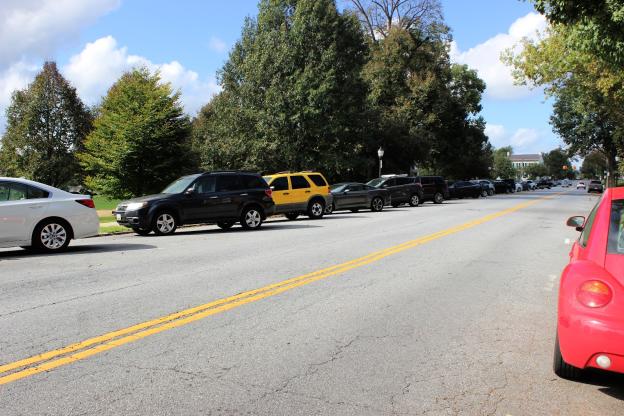 Cars parked along Carroll Parkway and College Avenue