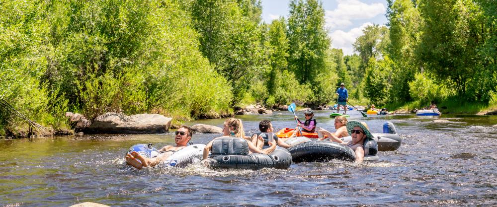 Families enjoy tubing the yampa river through downtown Steamboat Springs
