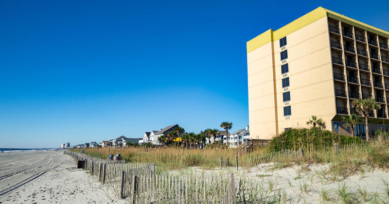 Beach in Surfside Beach with beach home and hotel