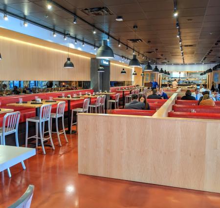 interior photo of the kitchen at butler's pantry in covington ky showing red booths and patrons dining