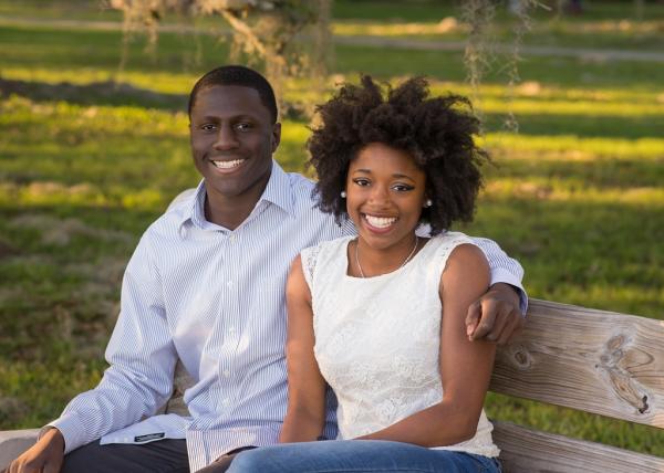 Chelsea couple sitting on bench at Mandeville Lakefront