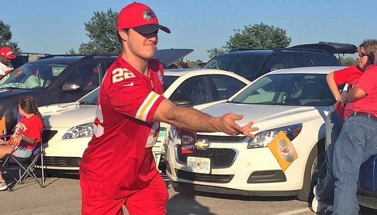 Playing cornhole while tailgating at a Chiefs game
